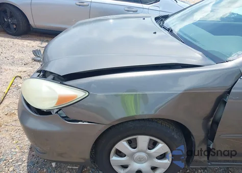 2004 Toyota Camry Le z USA, uszkodzony, nr VIN 4T1BE32K74U822587